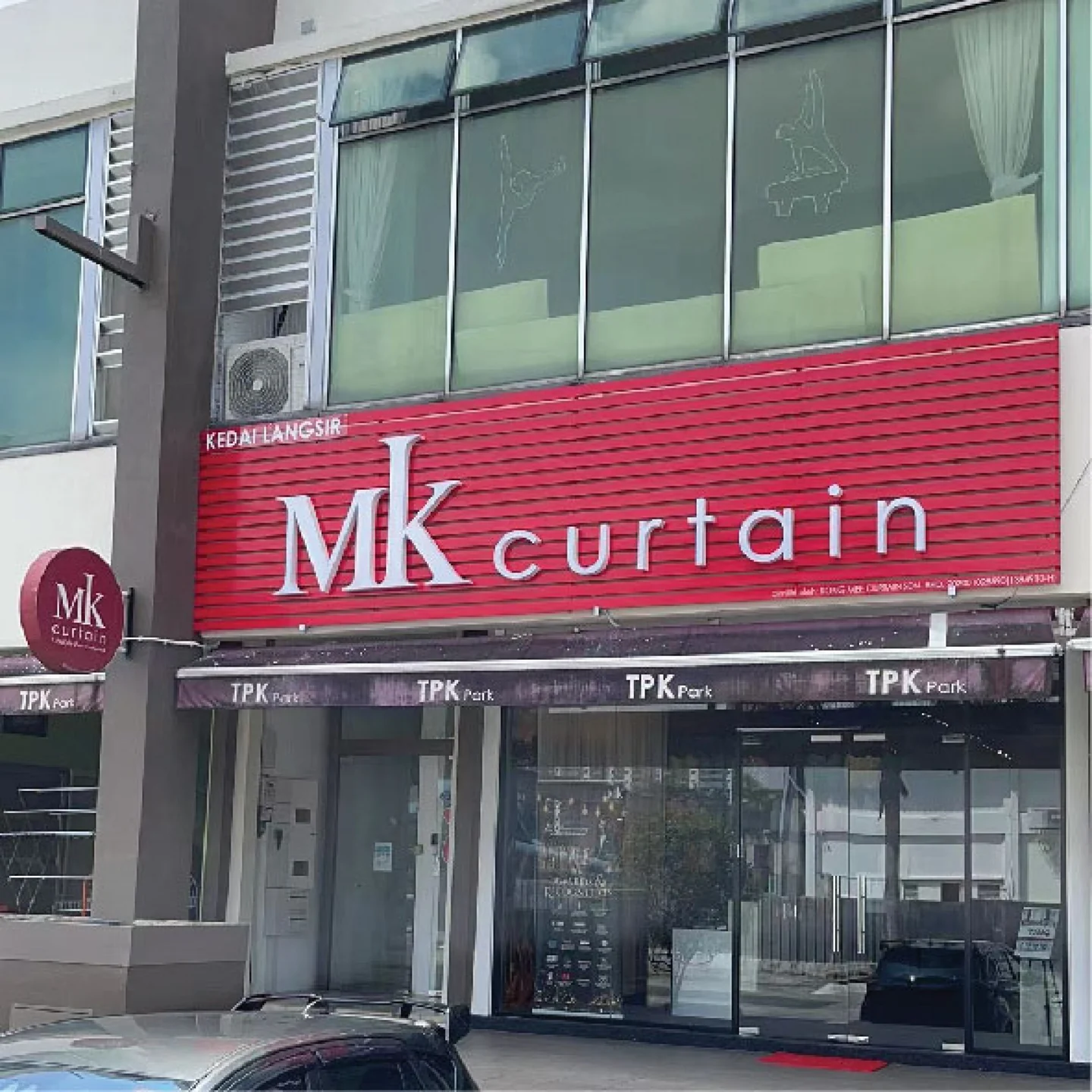 The MK Curtain TPK Park Puchong showroom, with its red MK Curtain sign above the glazed entrance
